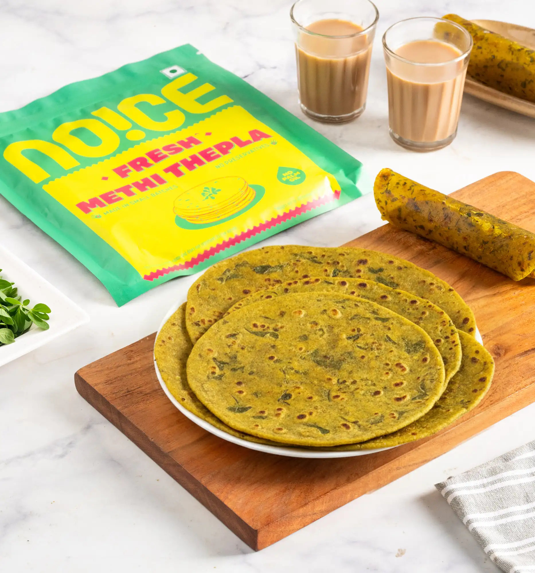 NOICE fresh methi thepla made with authentic spices and zero palm oil, stacked and ready to serve.