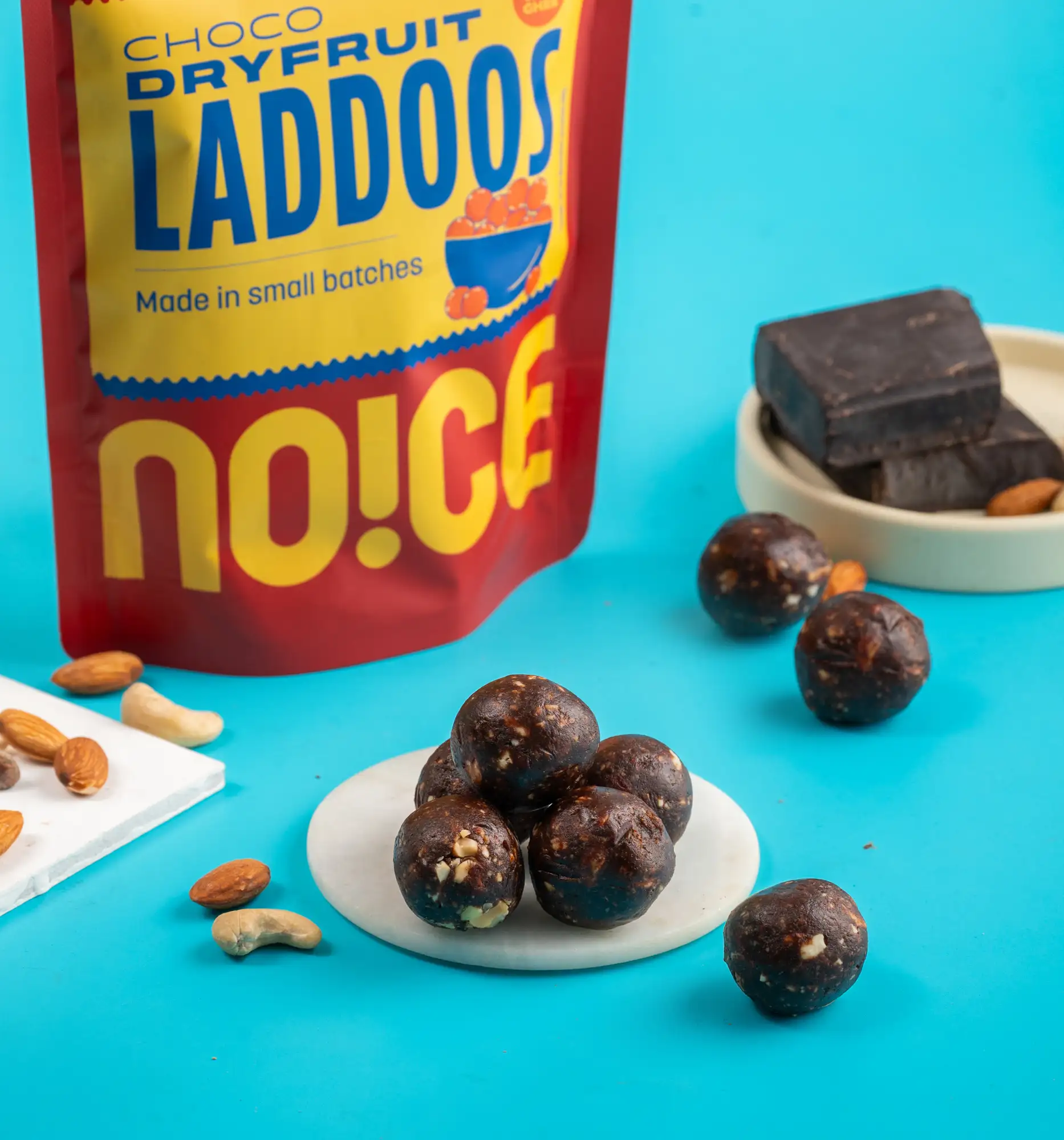 NOICE Choco Dry Fruit Laddu made with premium dates, almonds, and cashews, dipped in smooth chocolate with zero palm oil.