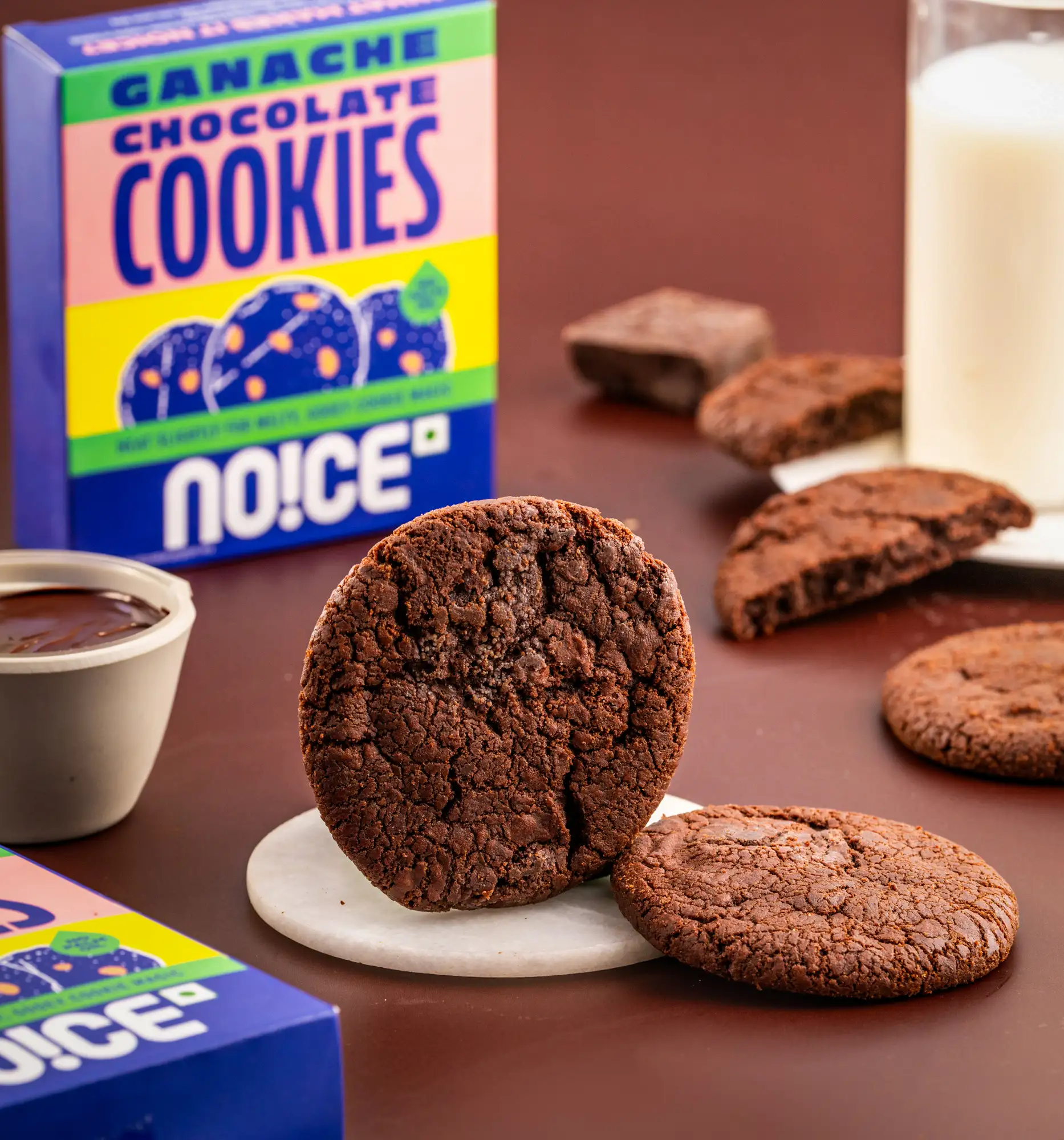 NOICE ganache chocolate cookies with a soft chocolate center and rich cocoa exterior.