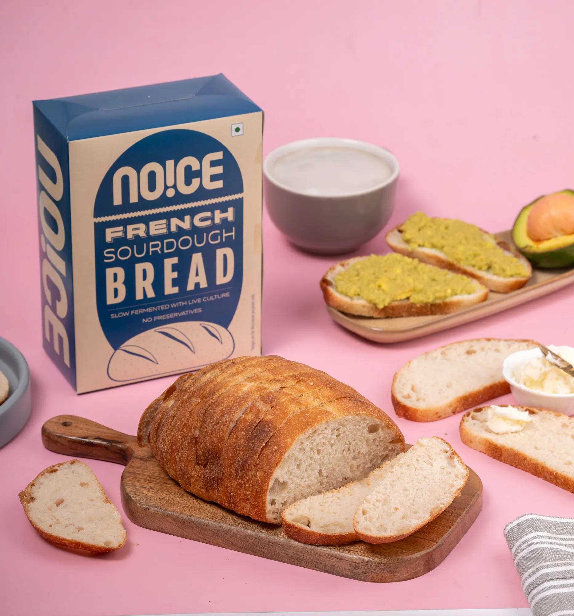NOICE freshly made French sourdough bread, small size sliced loaf with a chewy texture and golden crust.