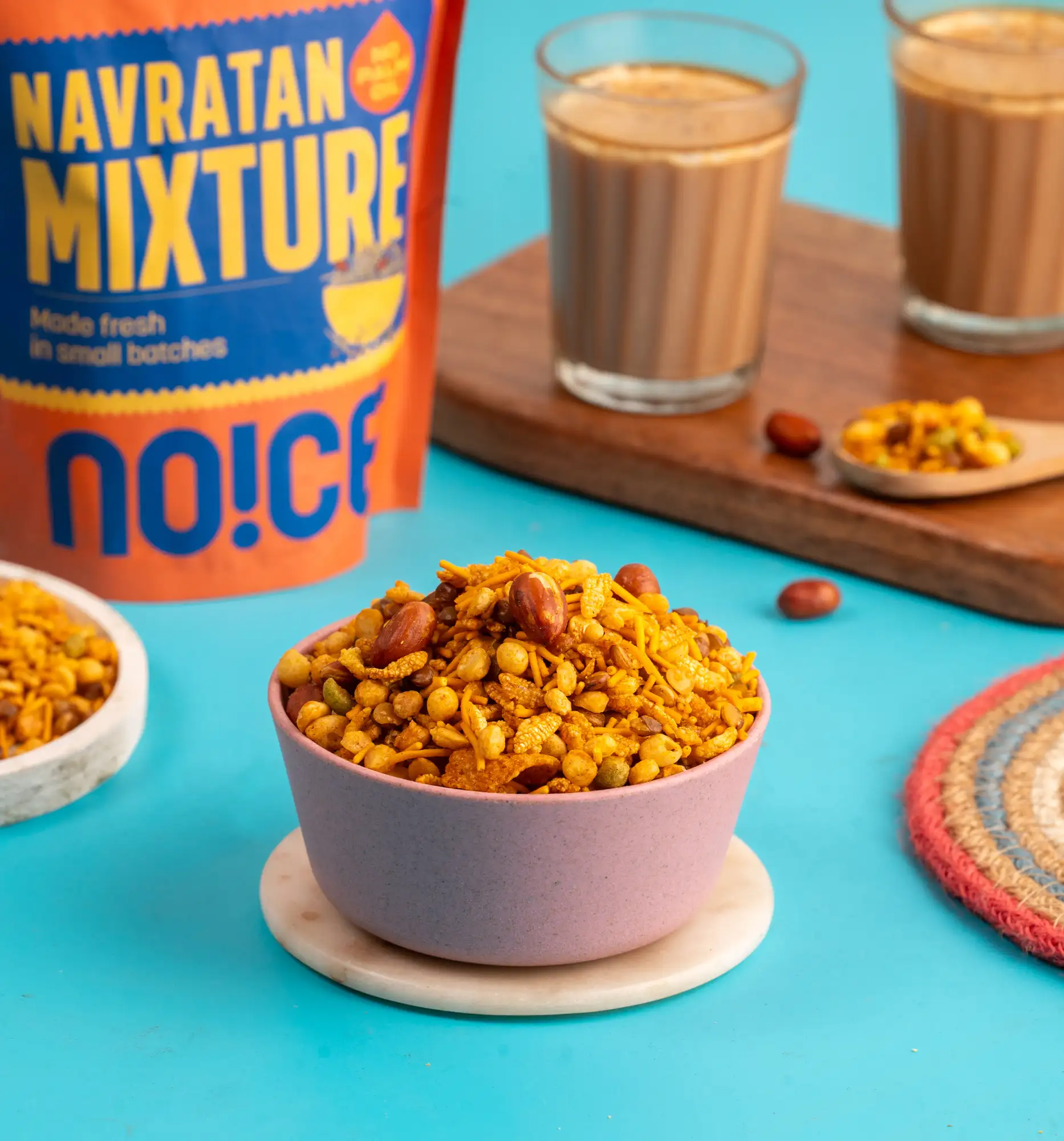 NOICE Navratan Mix, a traditional and crunchy savory Indian snack blend featuring nine premium ingredients including nuts, lentils, and sev, handcrafted without palm oil.