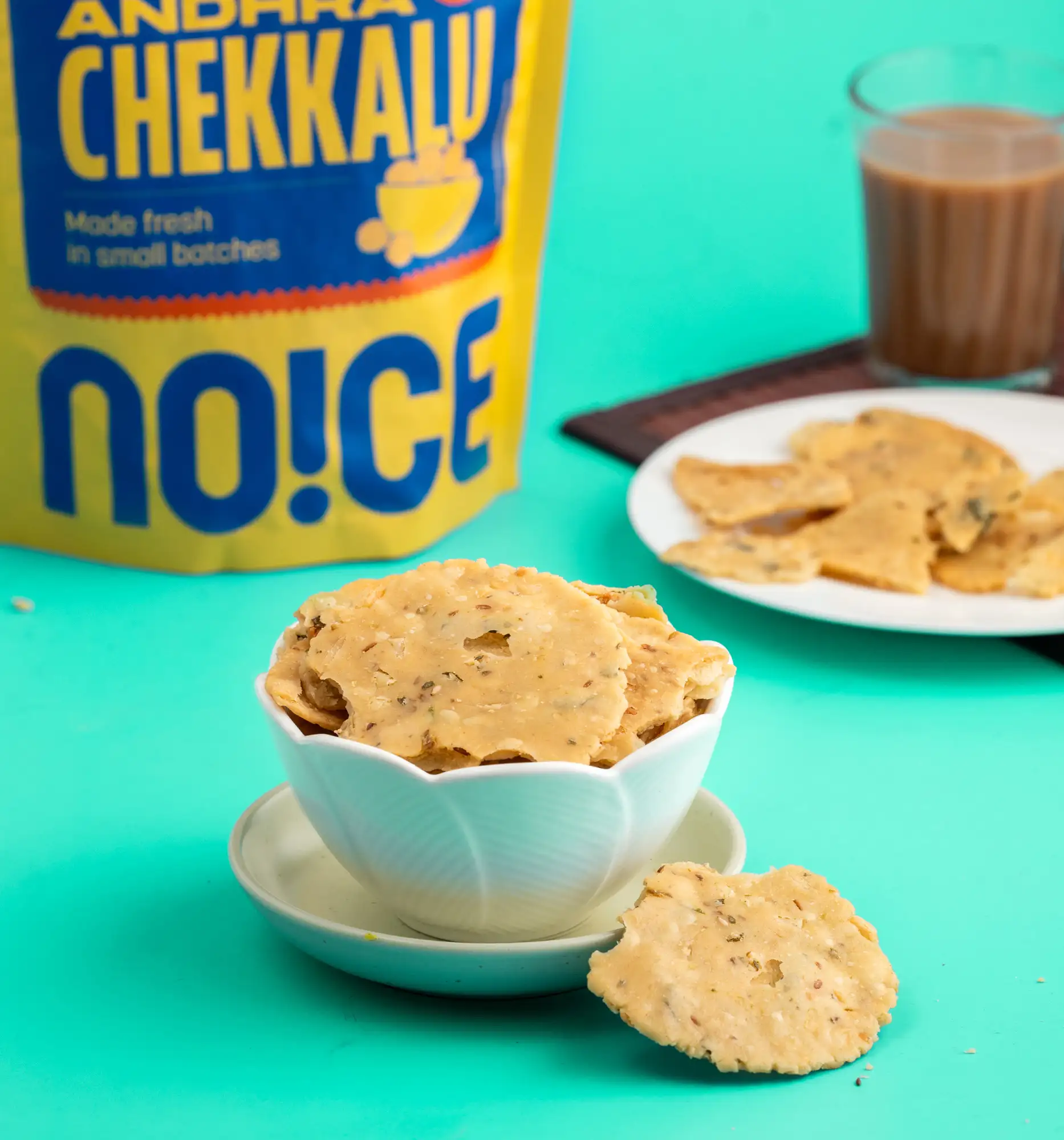 NOICE Andhra Chekkalu, golden and crunchy round bite-sized savory rice flour discs, handcrafted with spices and zero palm oil.