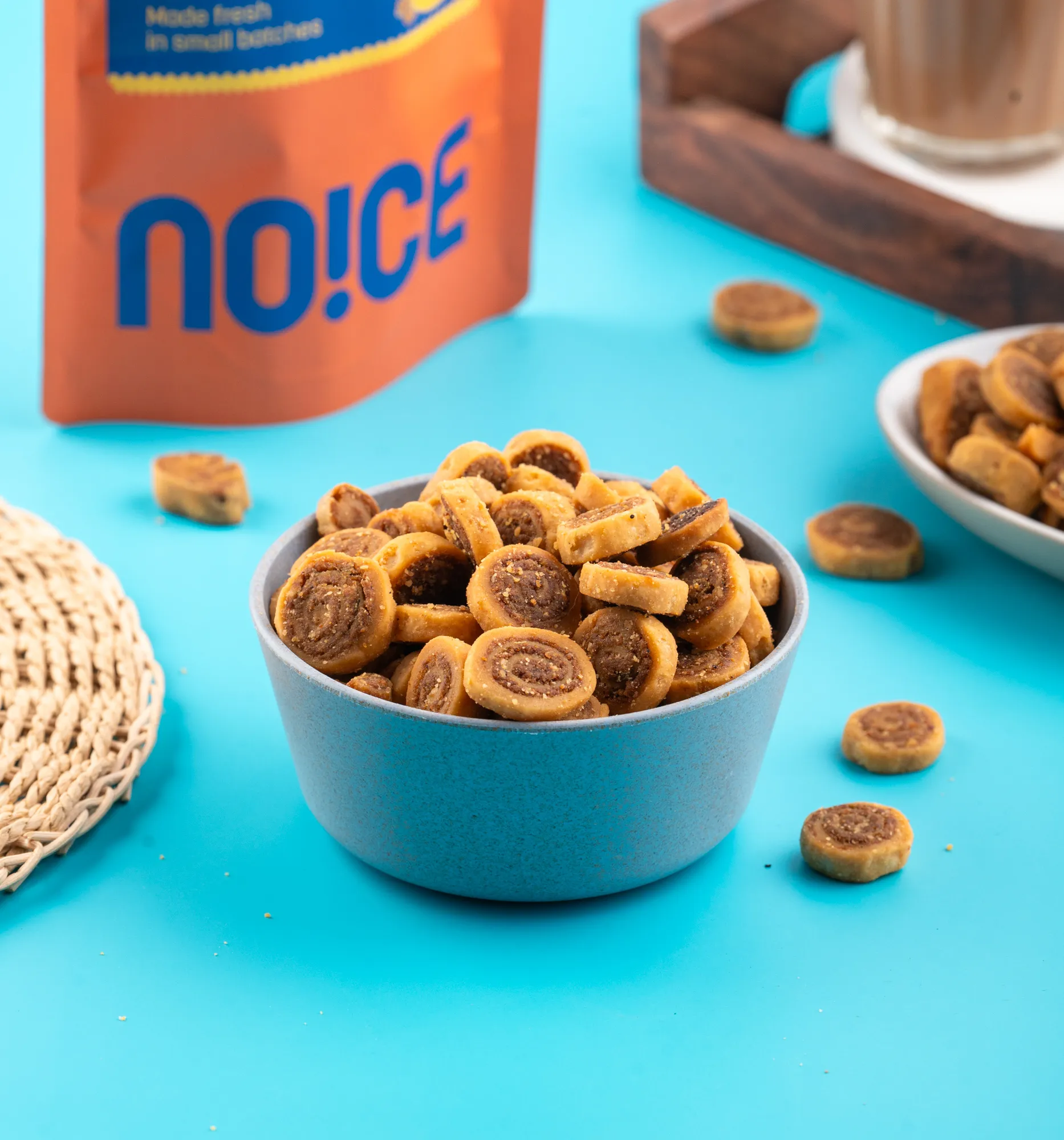 NOICE Mini Bhakarwadi, bite-sized crunchy Maharashtrian snacks with a spicy spiral filling, made with fresh rice bran oil and completely free from palm oil