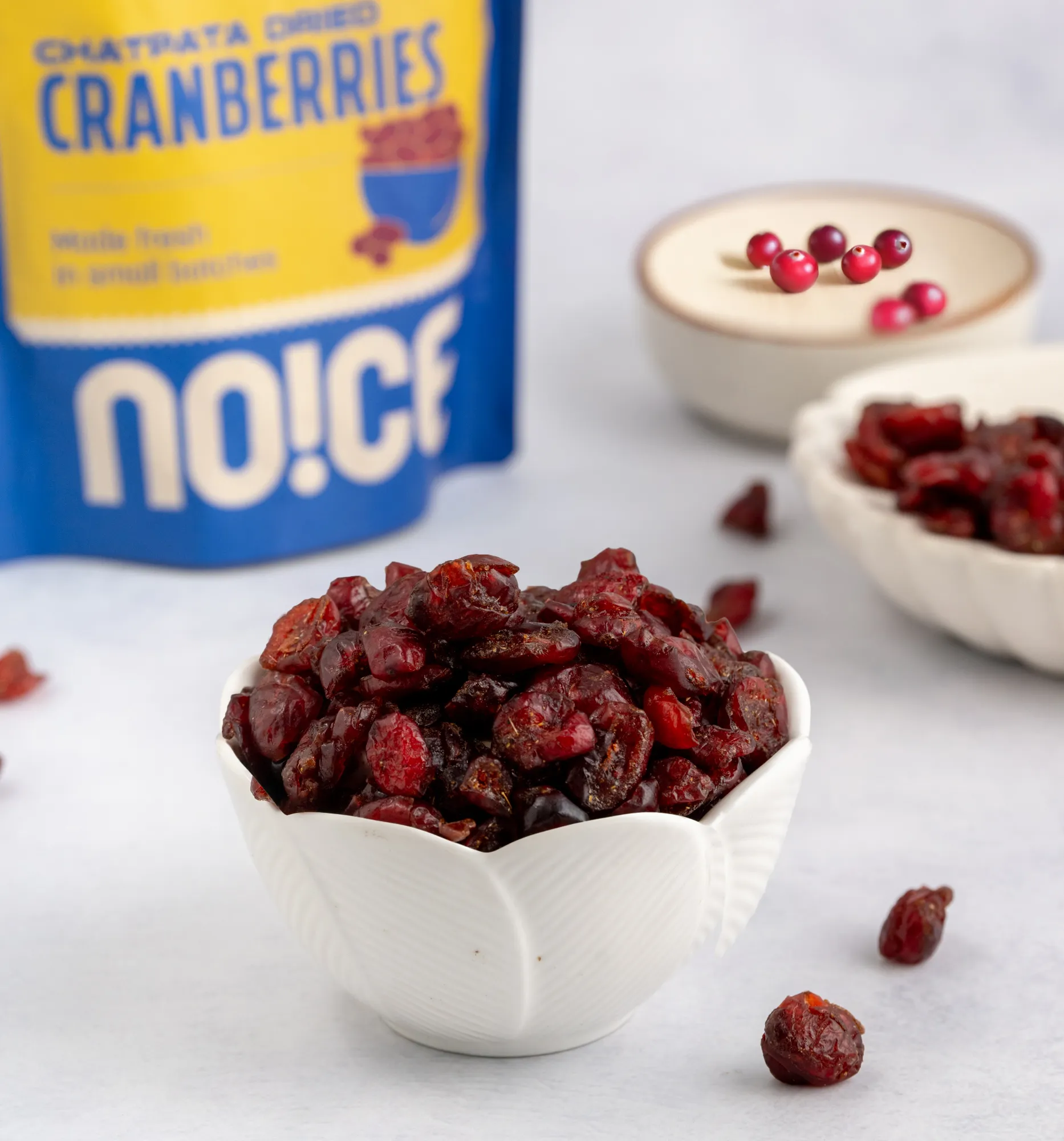 NOICE Chatpata Dried Cranberries, chewy and tangy cranberries coated in a zesty Indian spice blend of black salt, pepper, and mango powder, made without palm oil.
