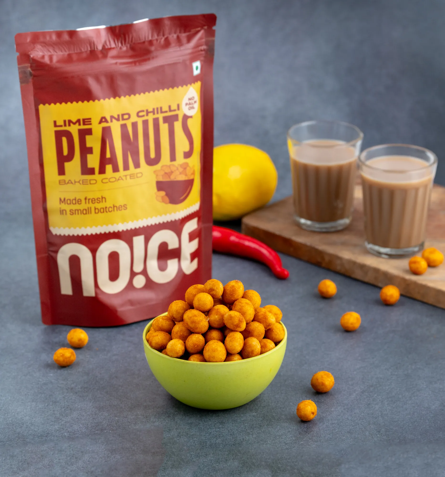 NOICE Lime & Chilli Peanuts, baked and coated crunchy peanuts seasoned with a zesty lime and spicy chili blend, crafted without palm oil.