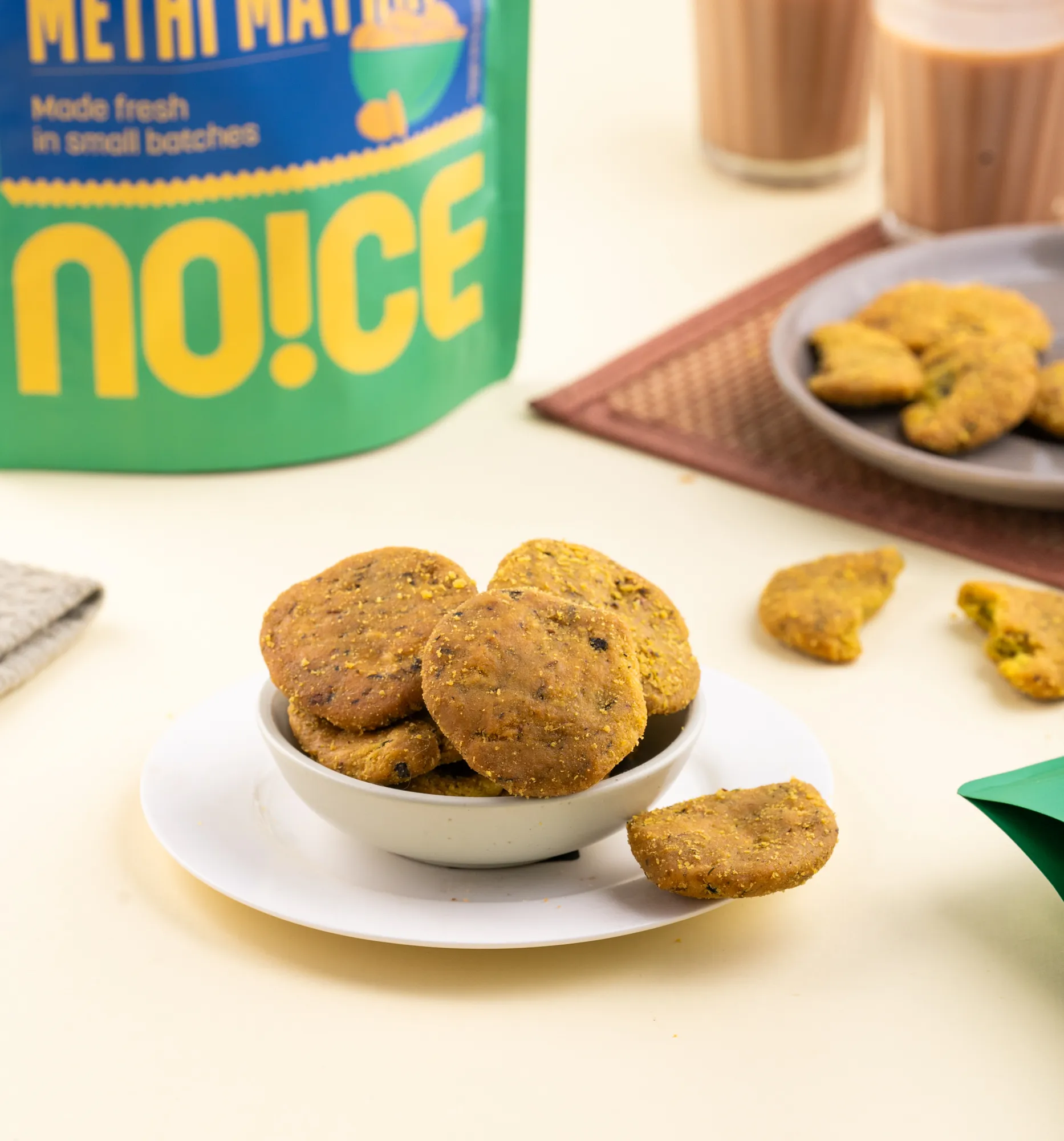 NOICE Homestyle Methi Mathri, flaky and crispy snacks with a subtle methi twist, handcrafted in small batches with fresh rice bran oil and zero palm oil.