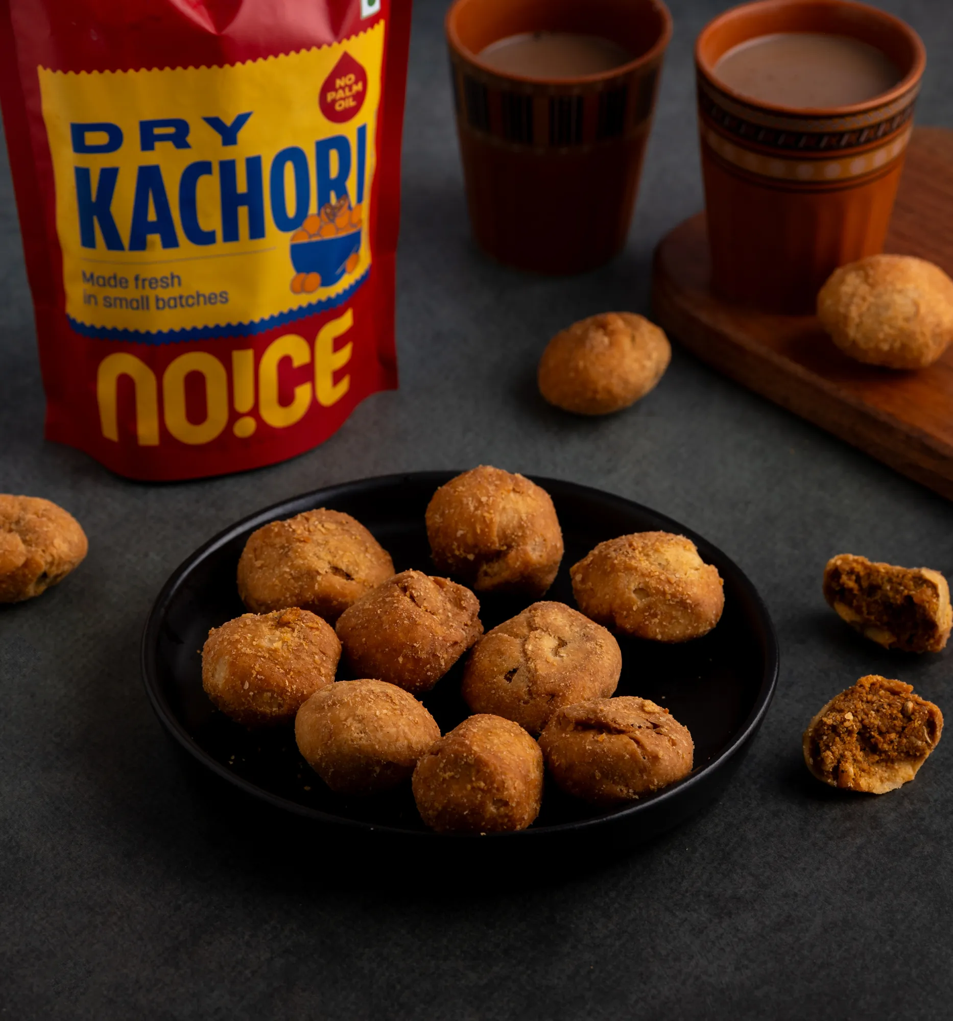 NOICE Dry Kachori, golden flaky pastry balls stuffed with a spicy and tangy dry lentil and spice filling, made without palm oil or artificial additives