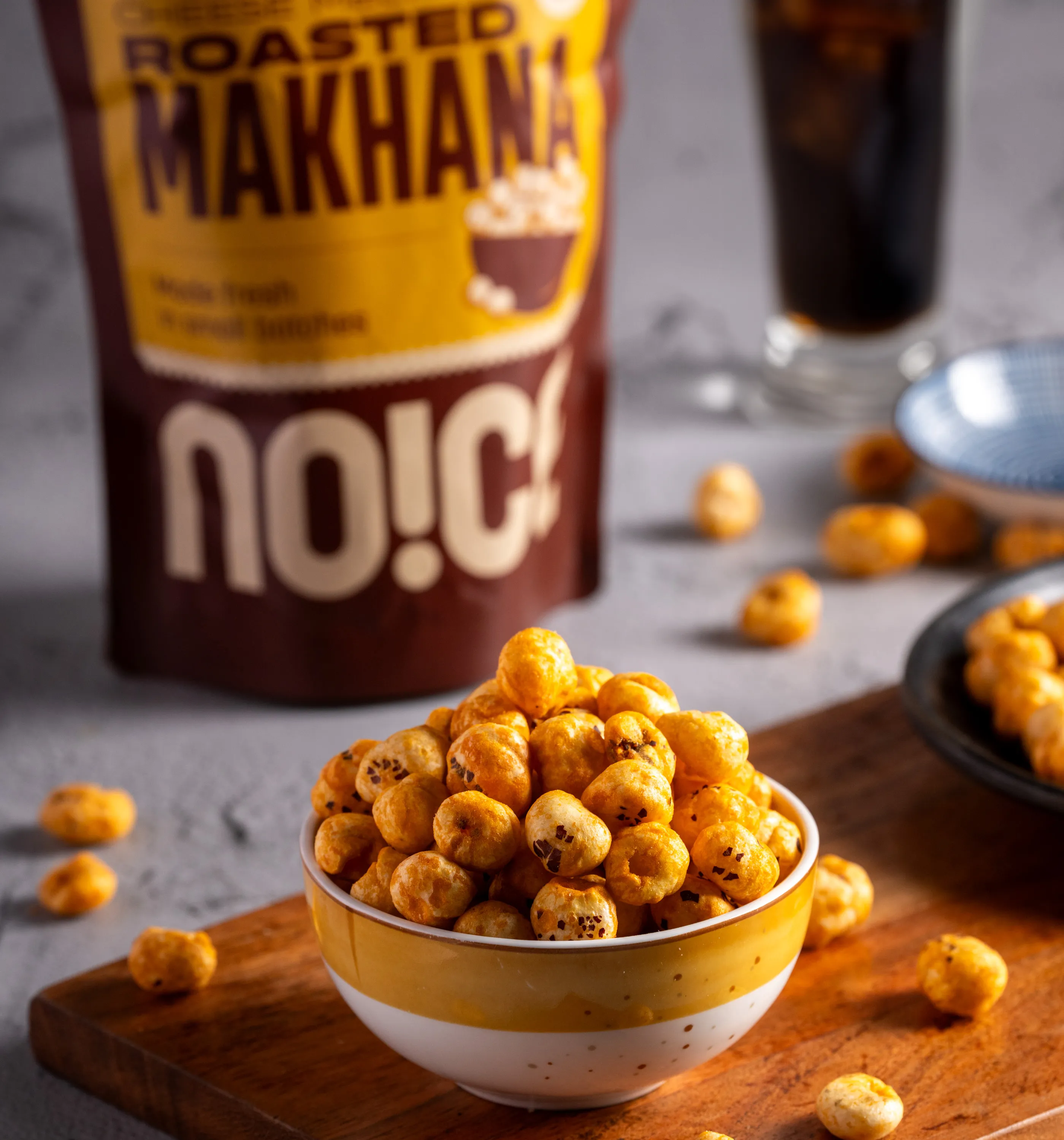 NOICE Cheese Melt Roasted Makhana, airy and crunchy fox nuts coated in savory cheese flavor, crafted in small batches with no palm oil and zero artificial colors