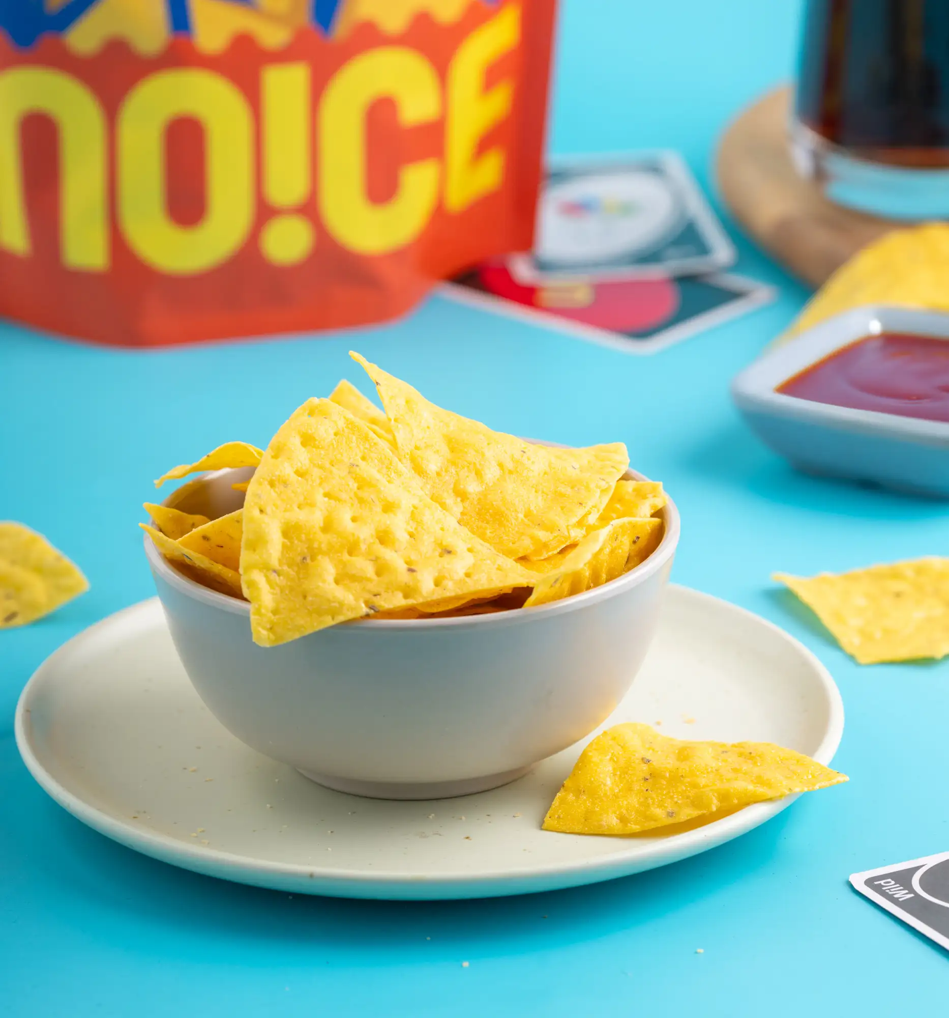NOICE Mexican Nachos Tortilla Chips, golden triangular corn crisps seasoned to perfection and made without palm oil or preservatives
