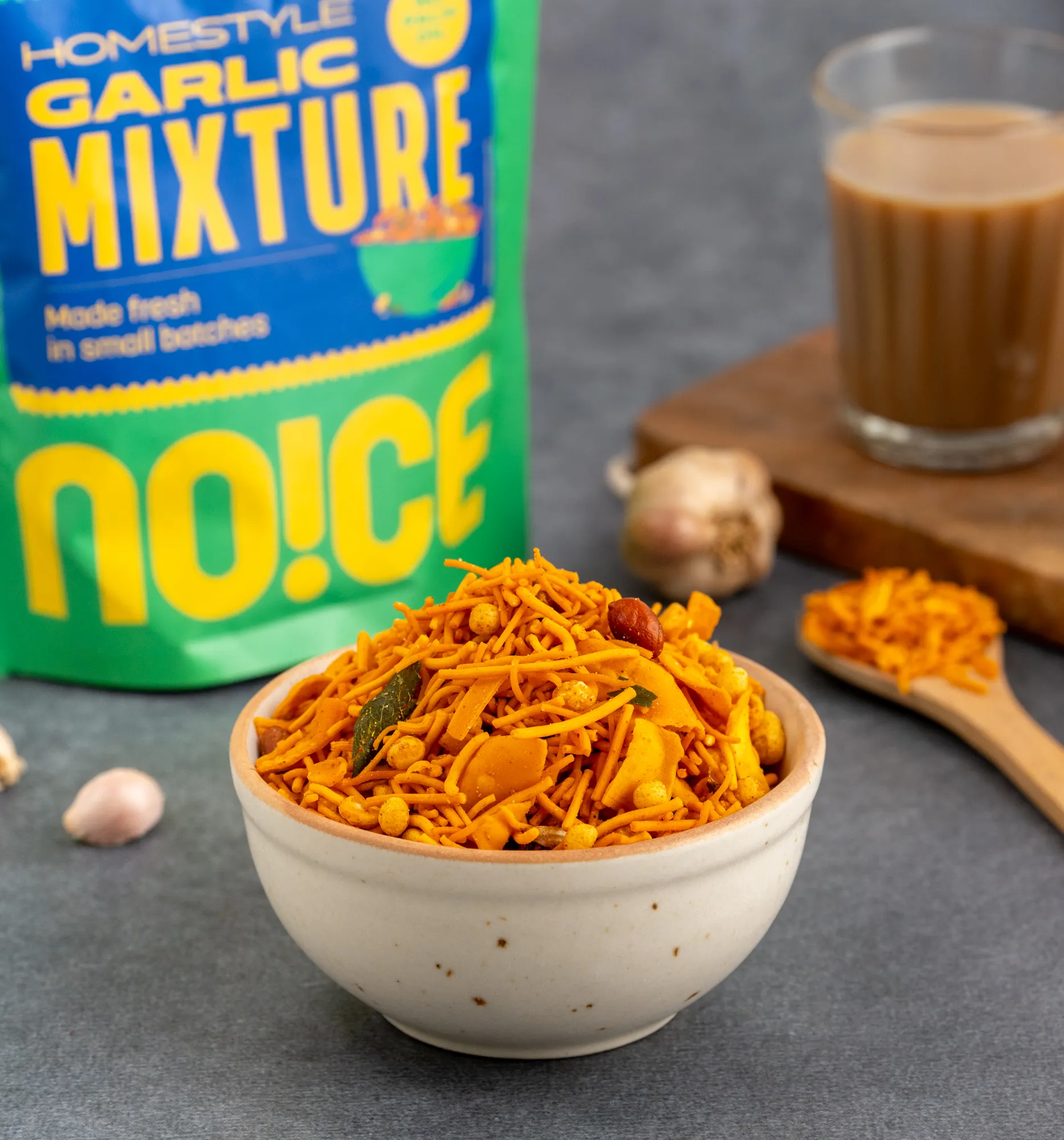 NOICE Homestyle Garlic Mixture, a savory and crunchy snack mix infused with bold garlic flavor and traditional spices, made without palm oil or preservatives