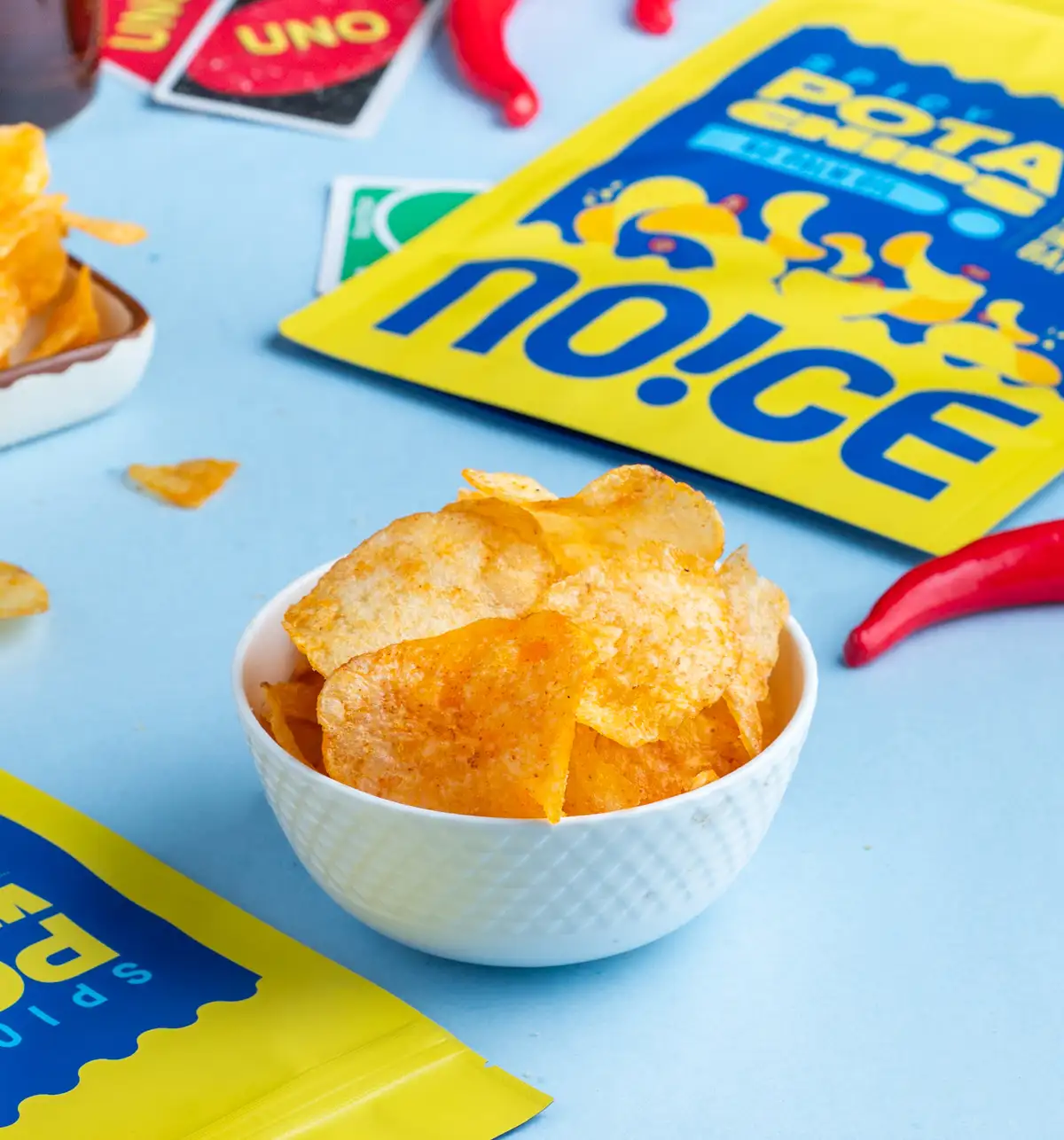 NOICE Spicy Potato Hot Chips, thin and crispy homestyle wafer snacks seasoned with real chillies and handcrafted in fresh sunflower oil.