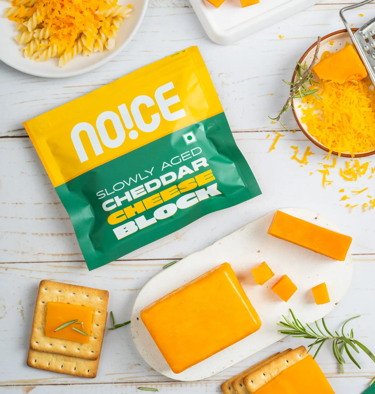 NOICE Slowly Aged Cheddar Cheese Block traditionally crafted from pure milk, slowly aged in small batches with no preservatives.