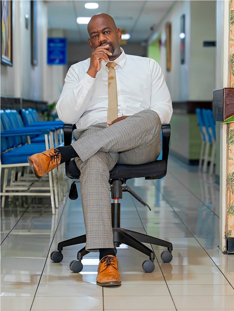 Dr. André Vaccianna seated in a hospital corridor