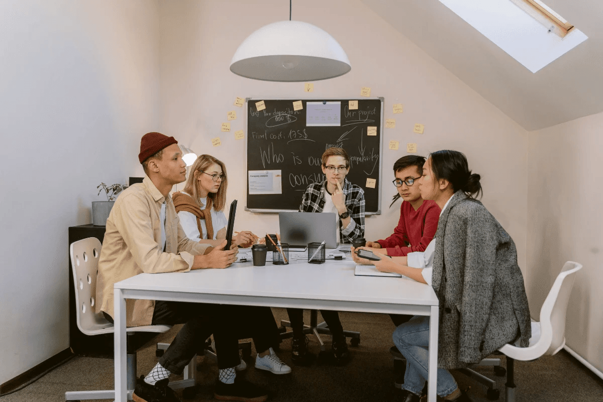 Diverse team engaging in a creative brainstorm session in a cozy office.