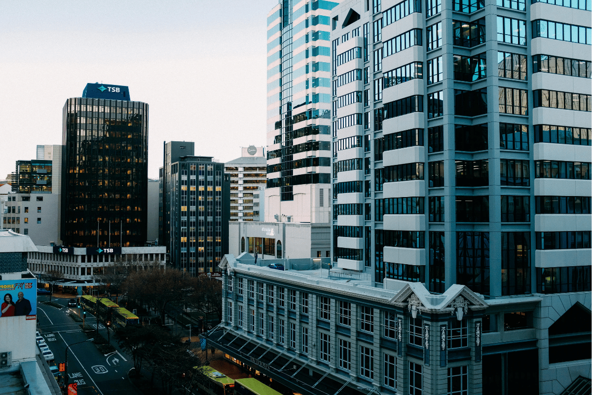 Cityscape with mix of modern and traditional architecture at dusk.