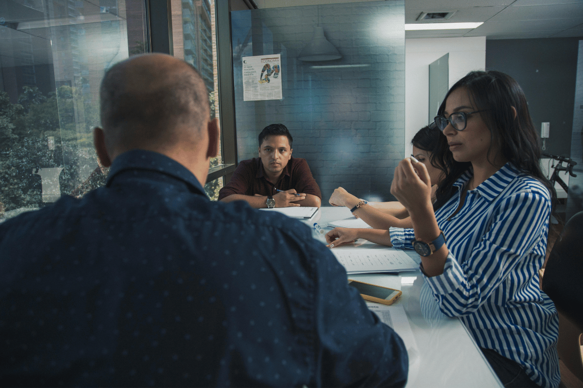 Modern workplace environment with coworkers interacting with each other.