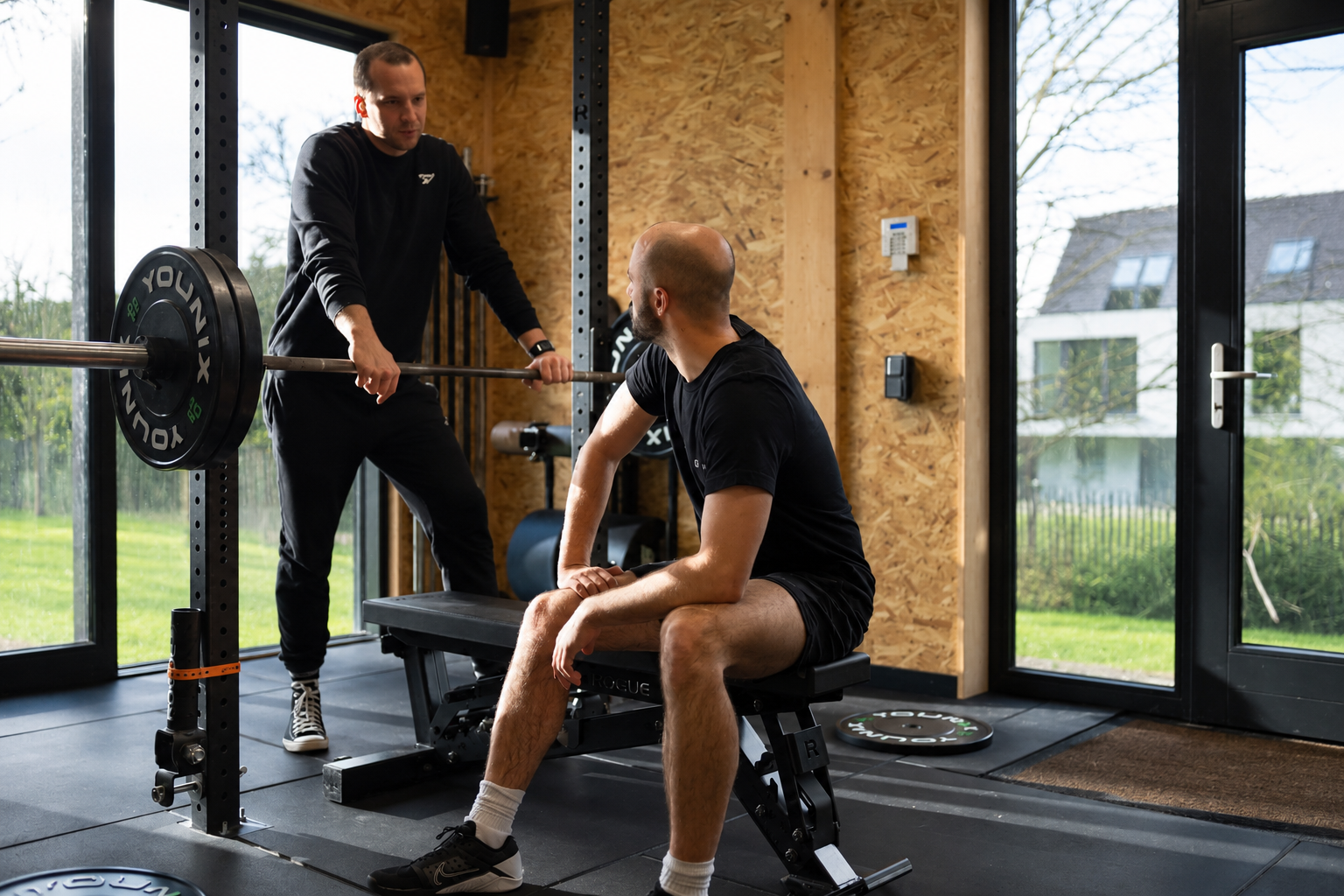 Échange entre coach et membre au studio TheHomeGym1410