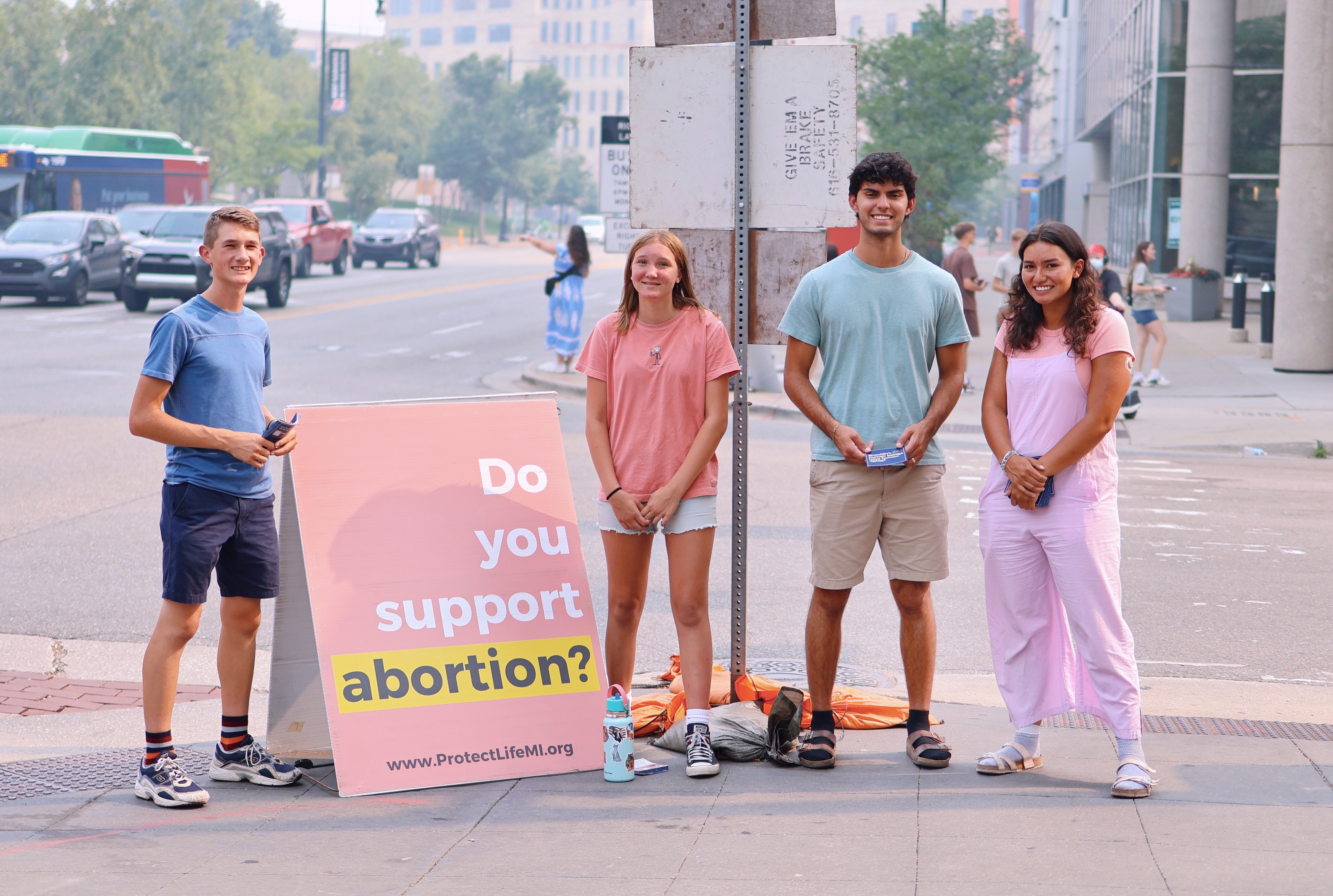 Protect Life Michigan students talking with passersby on a Michigan campus