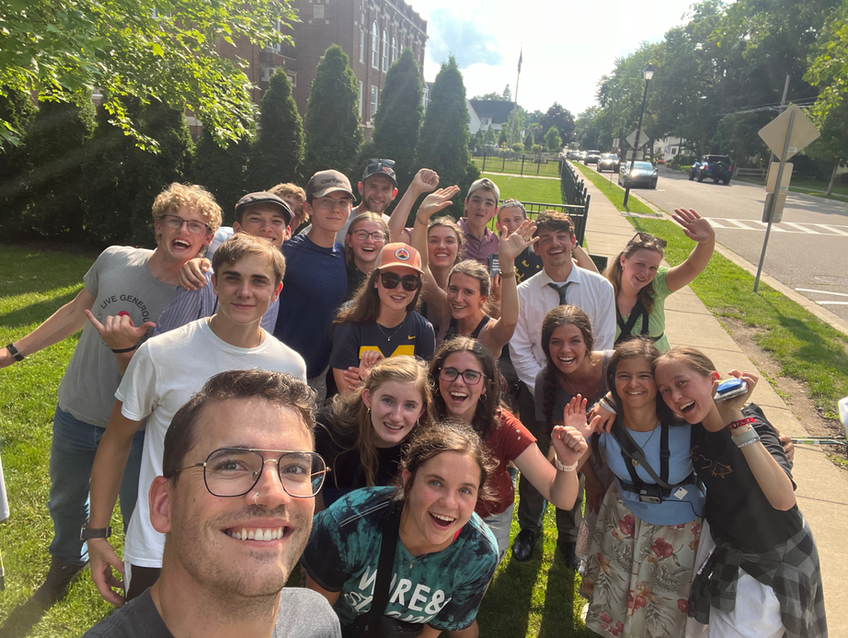 Protect Life Michigan staff member taking a selfie with a group of student activists outside on campus