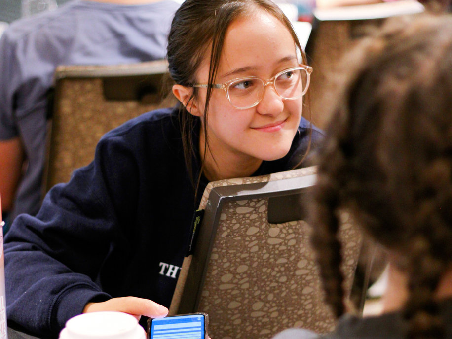 Leona, a Protect Life Michigan student, smiling in a lecture hall