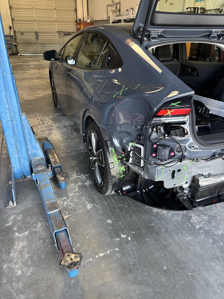 Charger with rear quarter panel repair in progress at Spark Collision Center