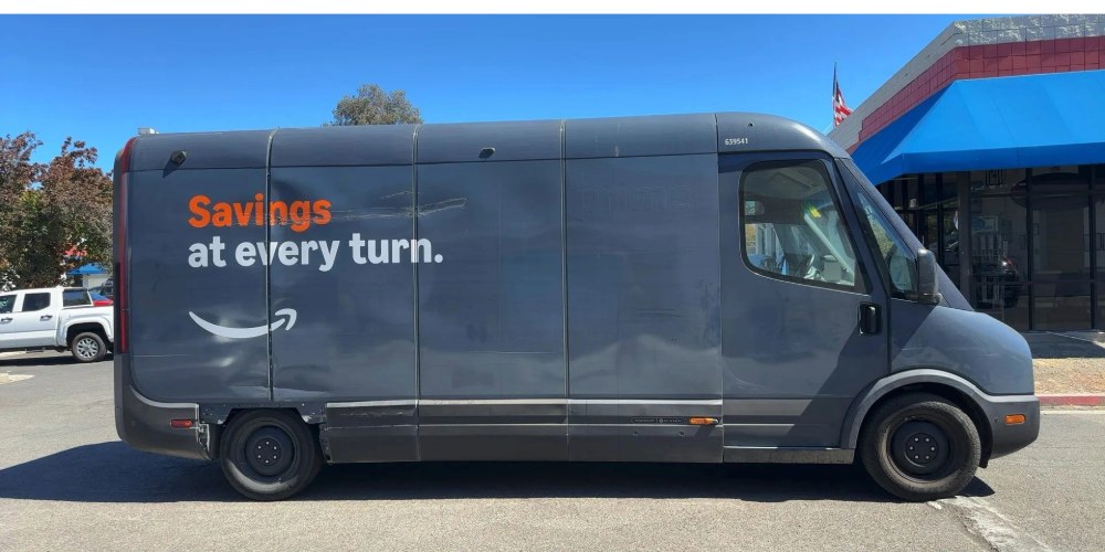 Amazon Rivian electric delivery van before collision repair at Spark Collision Center in Fremont, scraped and dented right side panels