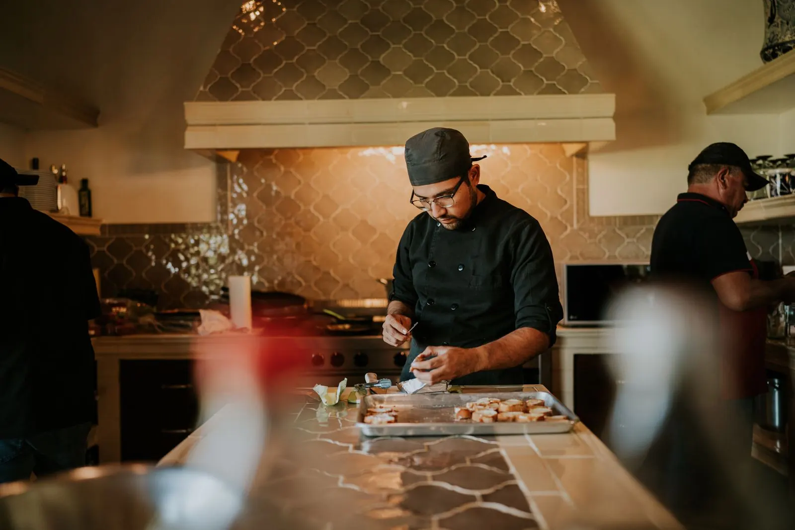 Chef plating a dish in the Gastro at 35 kitchen