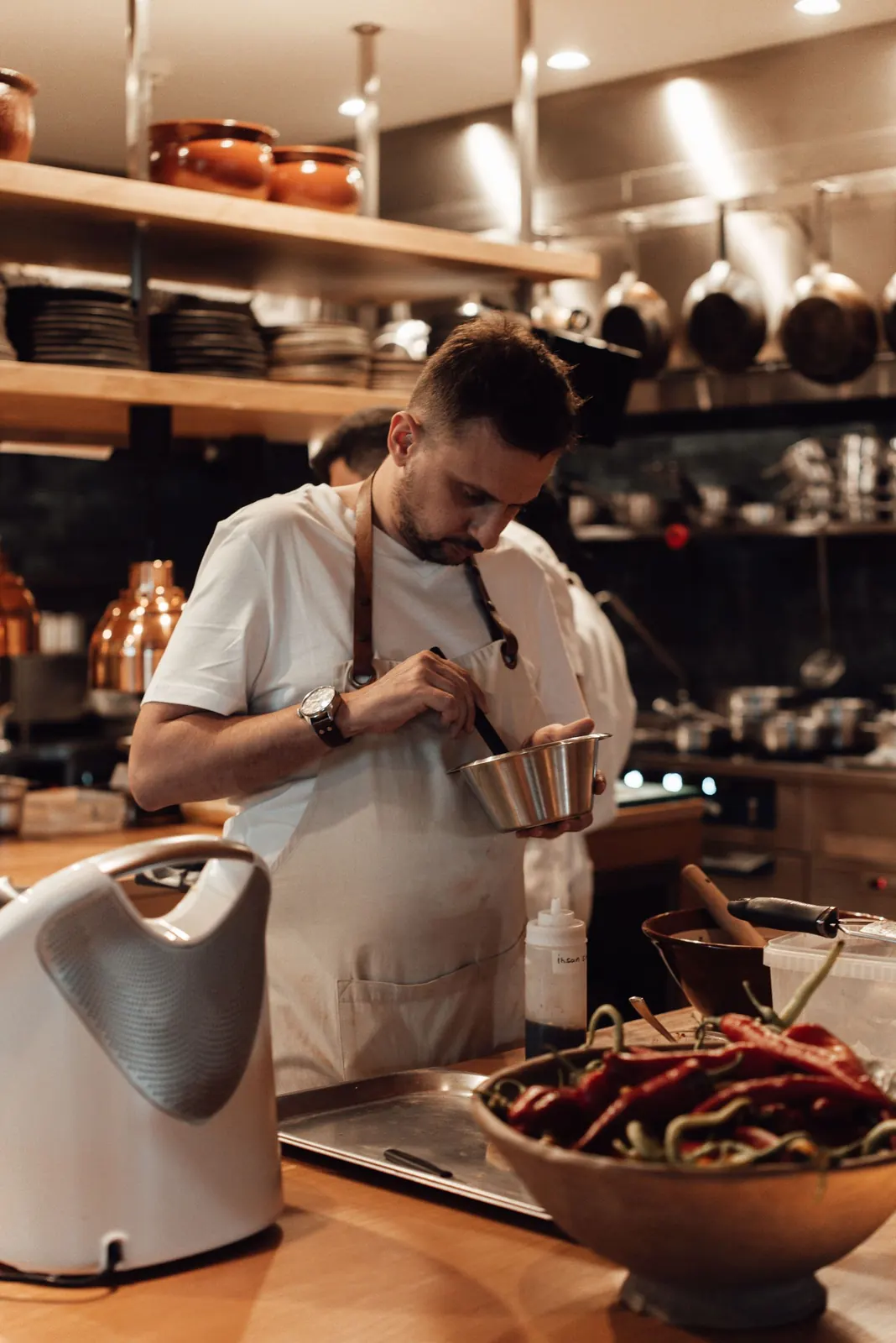 Chef's hands preparing ingredients at Gastro at 35