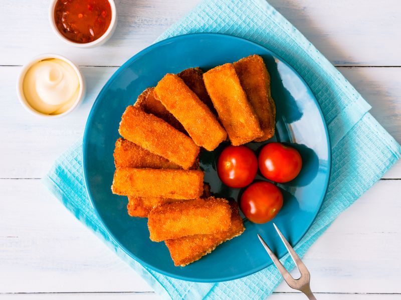 Crispy mozzarella sticks with dipping sauces