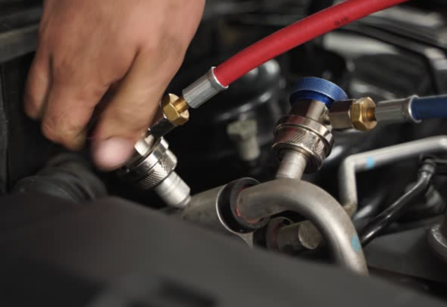 A/C service in the bay at Davis Automotive in Dallas, Texas