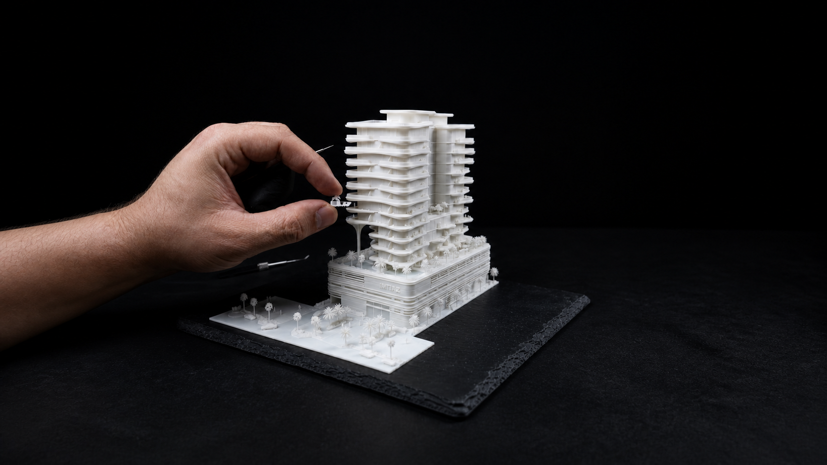 Close-up of a detailed architectural model showing precision and material craft