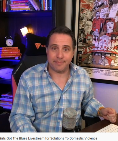 A man on a livestream for Girls Got the Blues benefiting Next Door Solutions