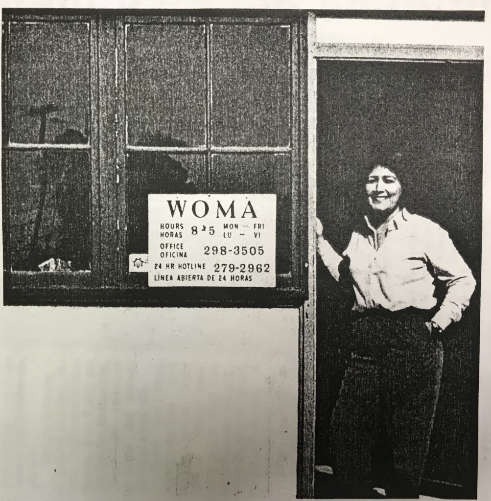 Bea Robinson stands in the doorway of the WOMA shelter