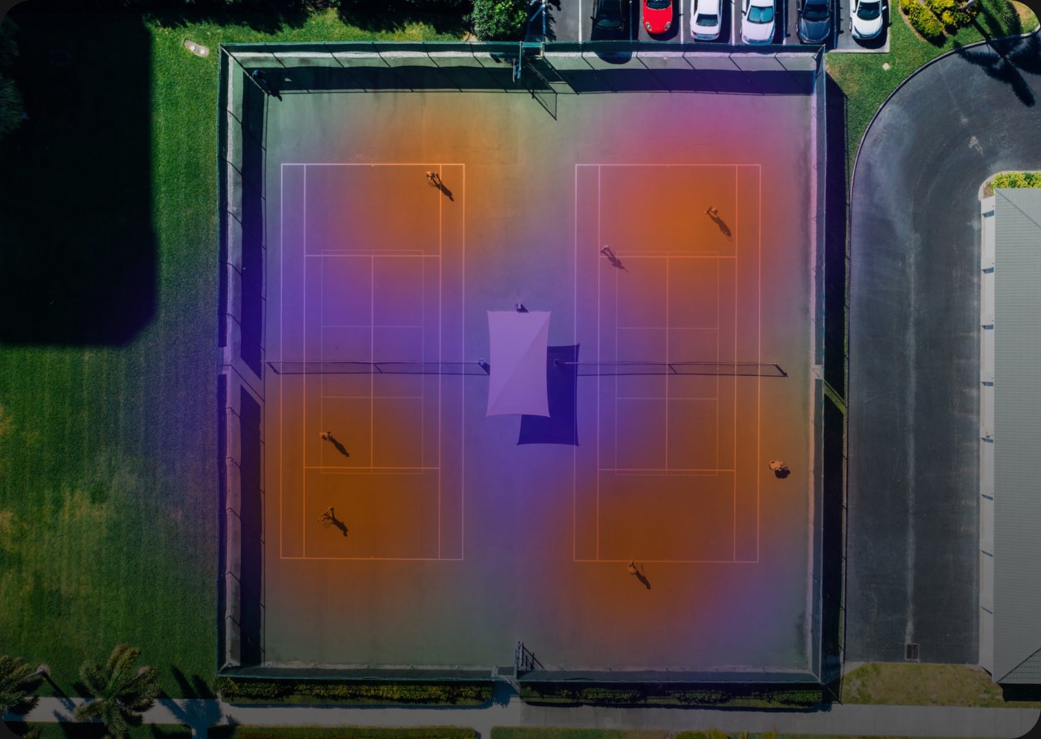 Overhead view of two tennis courts with a thermal map overlaid