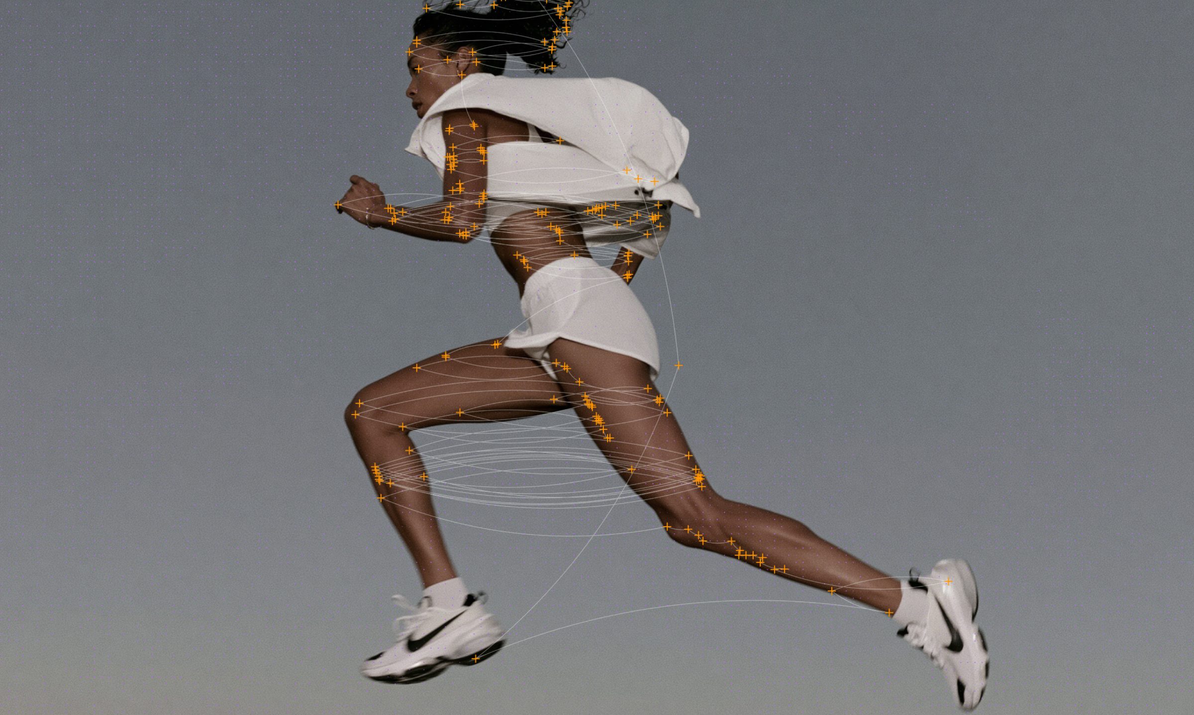 Runner mid-stride with a dense grid of pose-tracking markers across the body