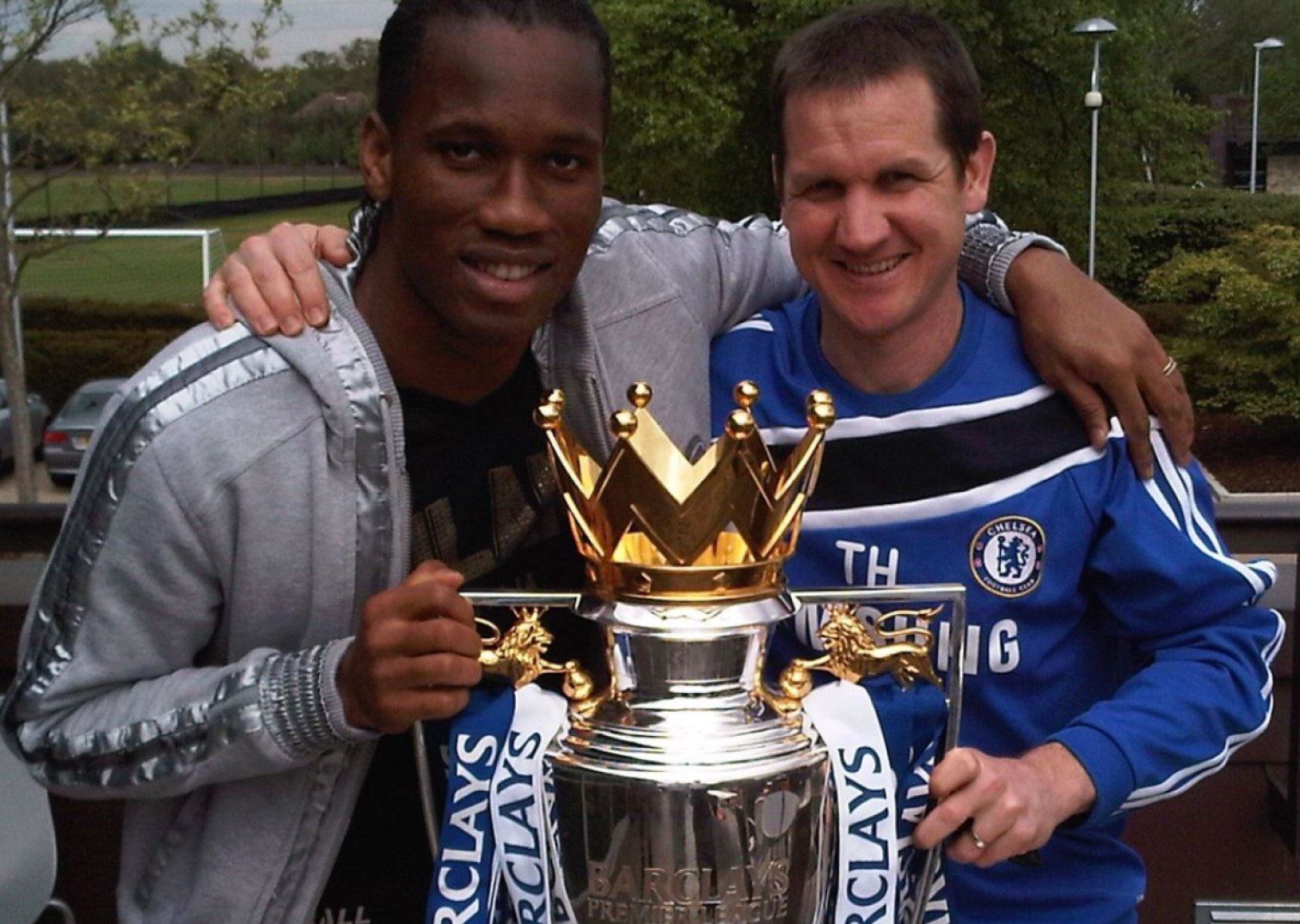 Tim Harkness with a Chelsea player and the Premier League trophy