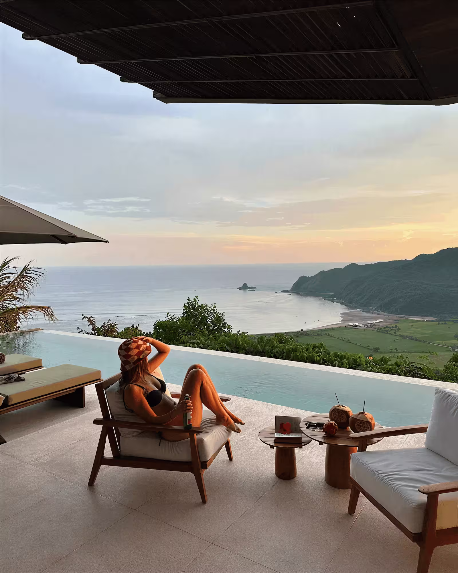 Sunset view in Lombok with silhouettes relaxing on the beach