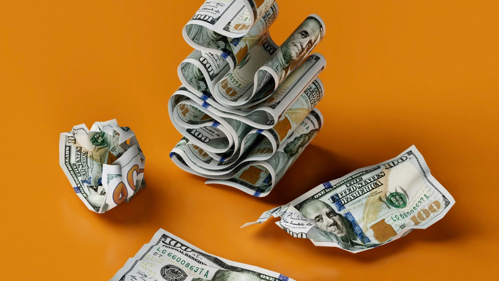 Crumpled dollar bills falling against an orange background