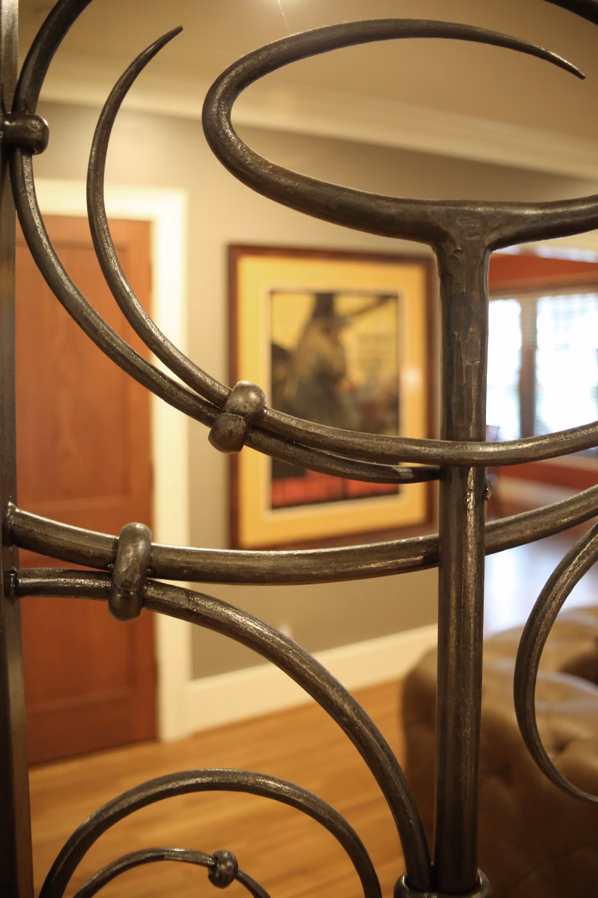 Close-up of the hand-crafted scrollwork on the custom wrought-iron interior gate