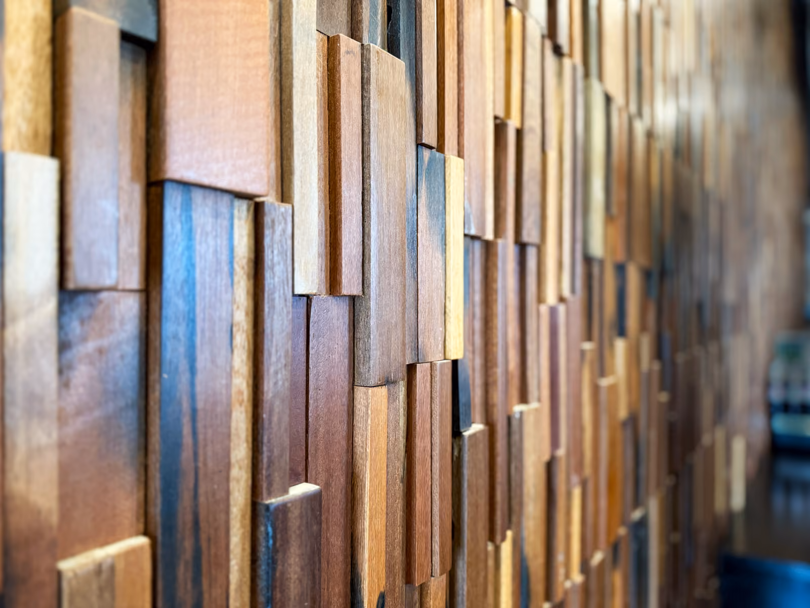 Close-up detail of the dimensional 3D wood block accent wall
