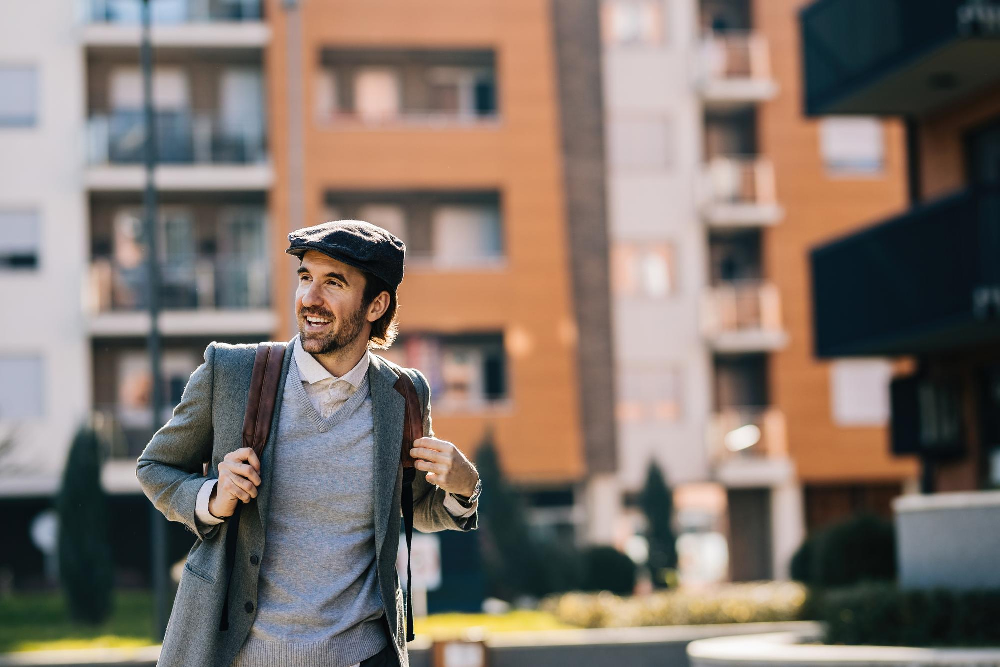 Resident walking outside a revitalized apartment community