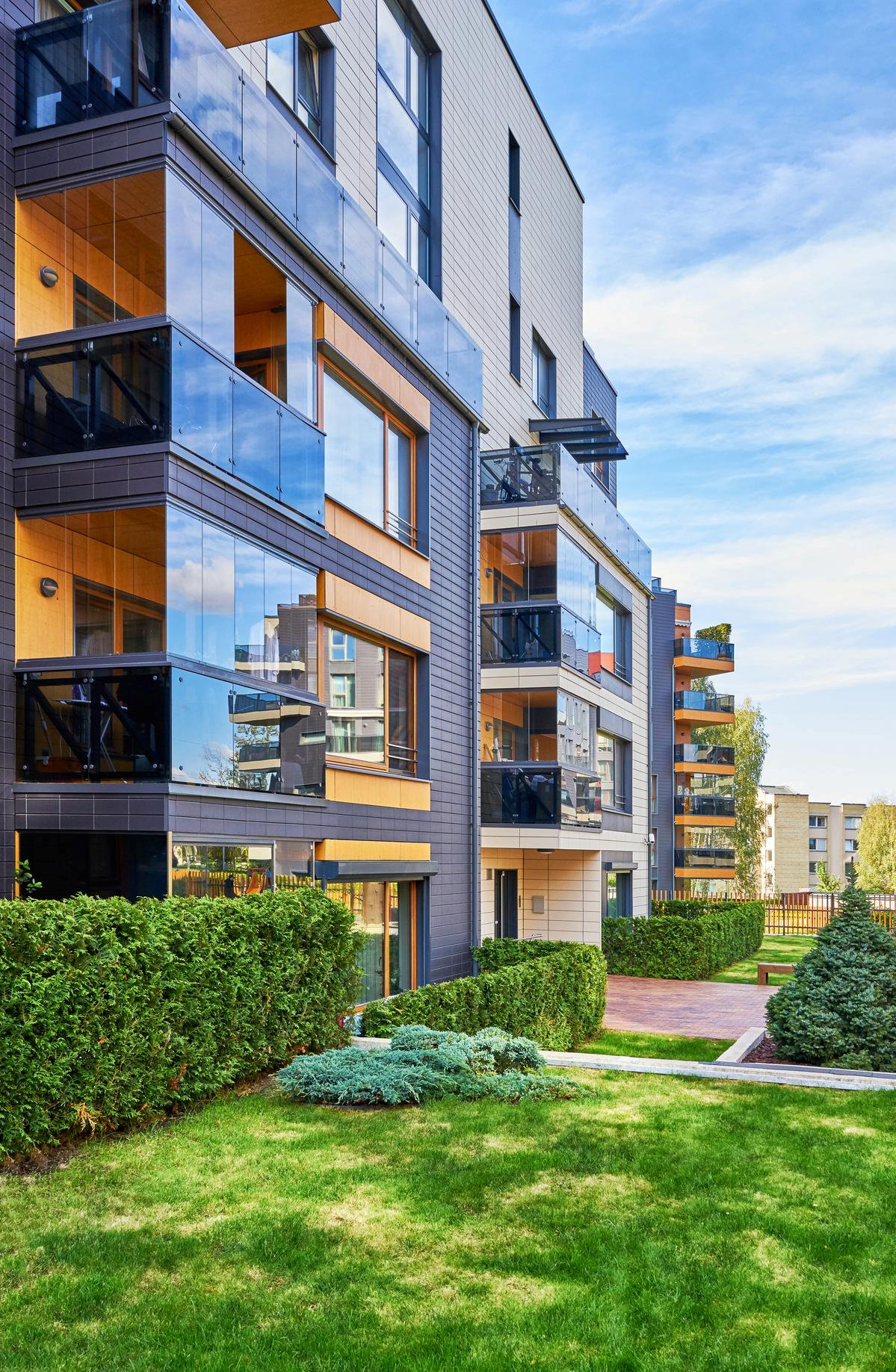 Modern apartment community with landscaped garden