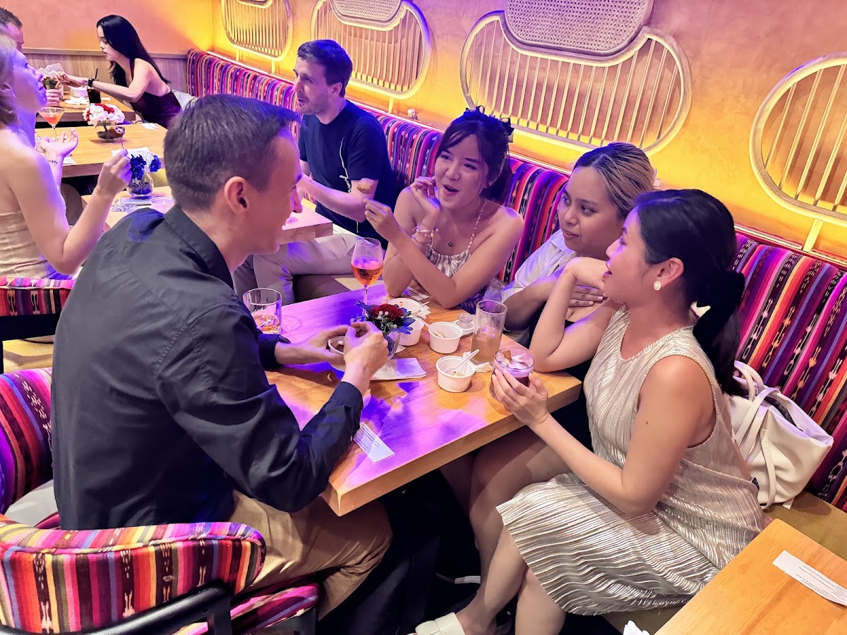 Members sharing a table at Carmina
