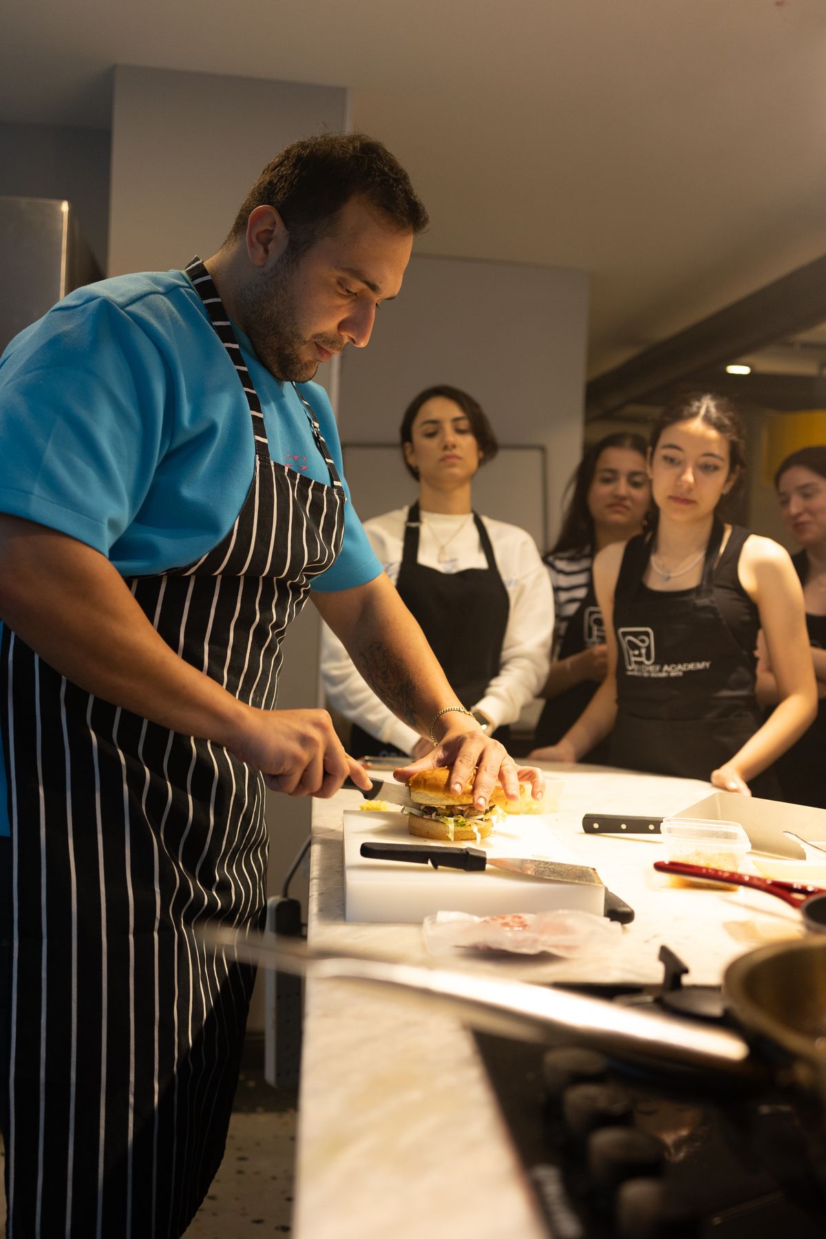 A chef leading a hands-on cooking workshop