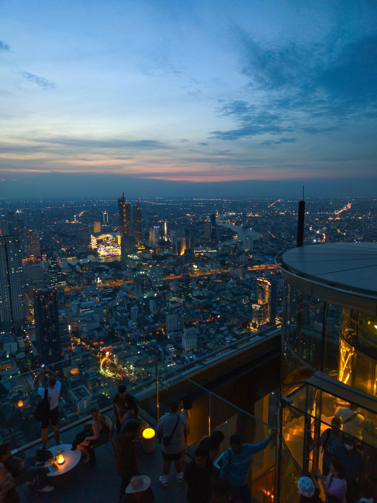 Bangkok's skyline at twilight seen from a rooftop