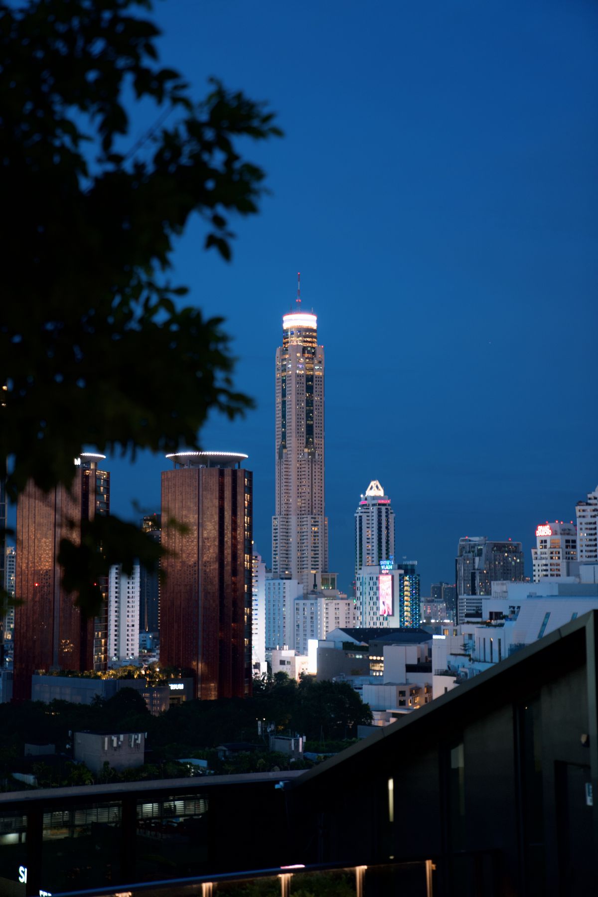 Baiyoke Tower rising over Bangkok at twilight