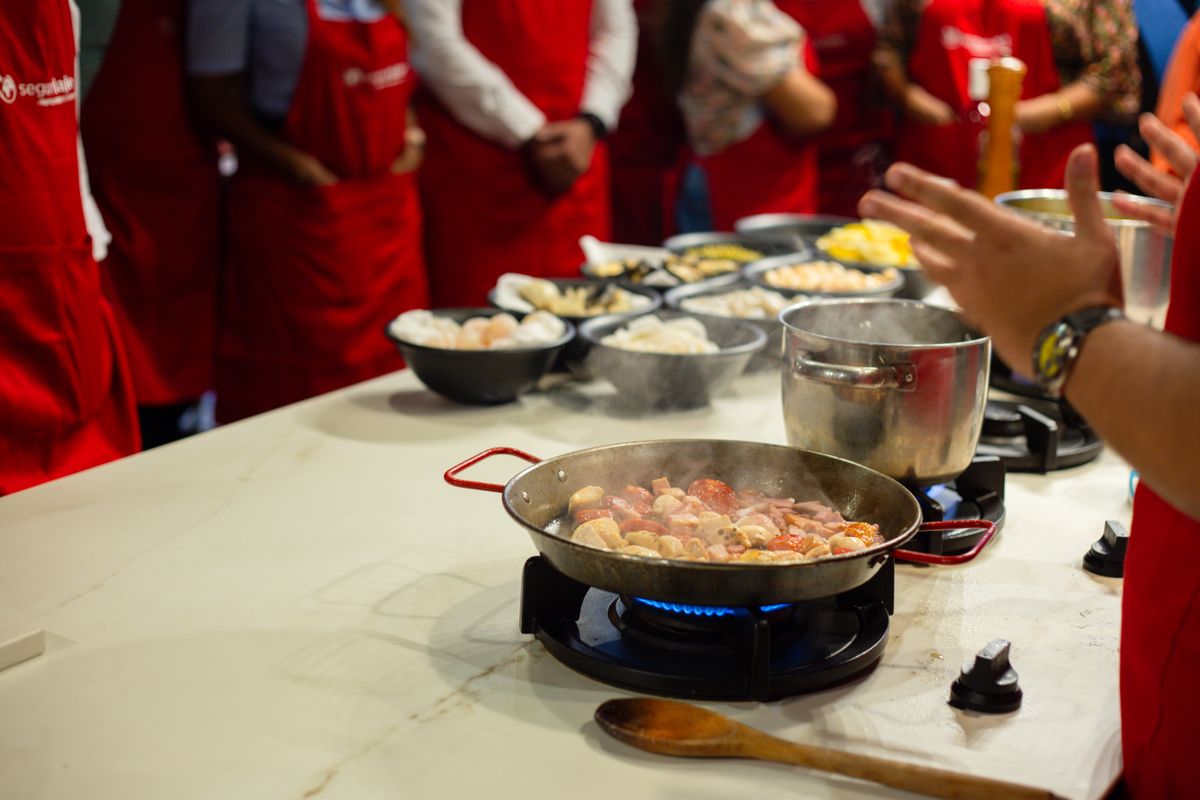 Participants side by side at a lively cooking class