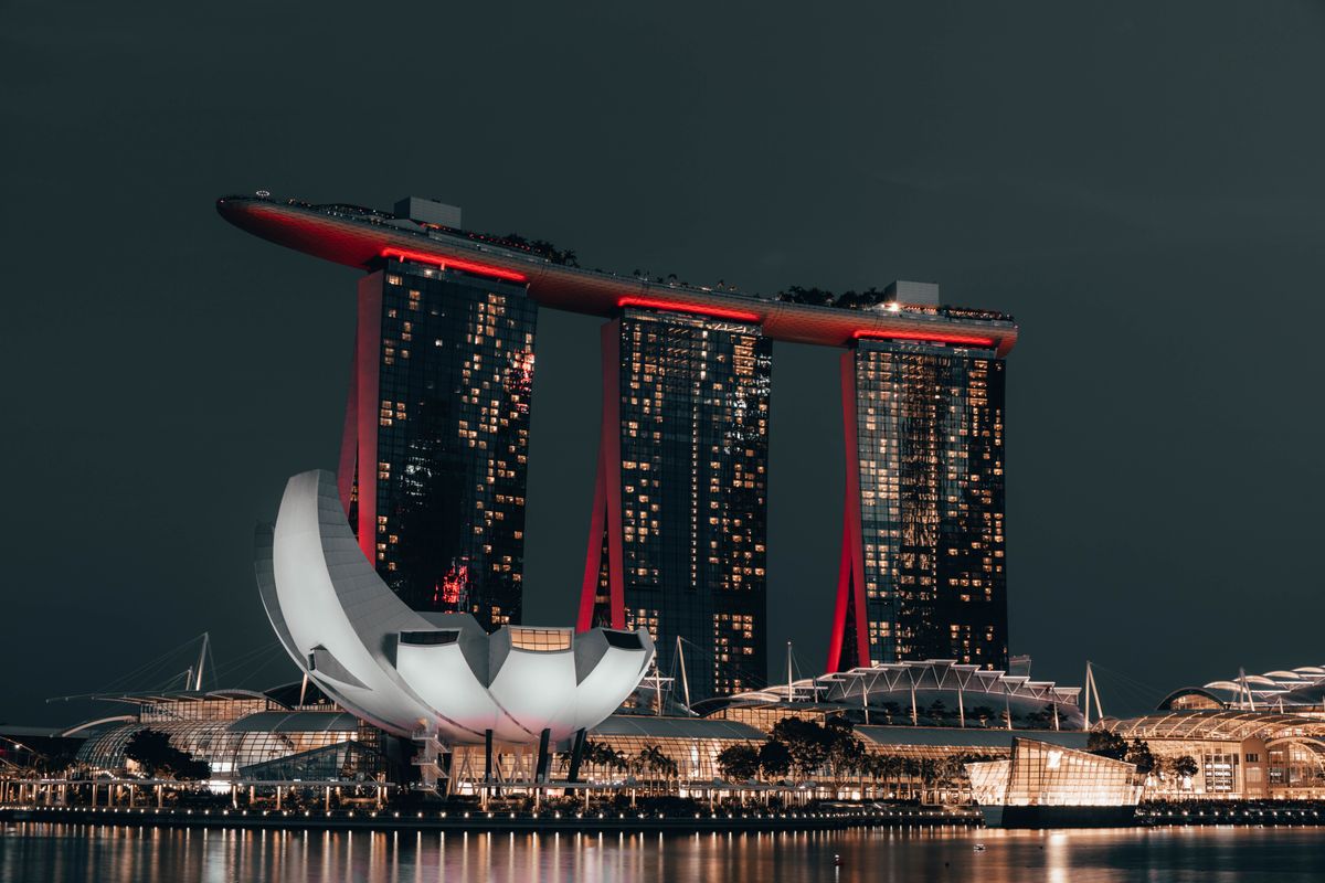 Marina Bay Sands glowing over the bay after dark