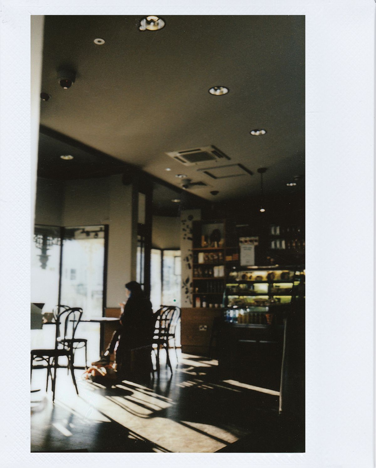 A quiet moment alone at a warmly lit café table