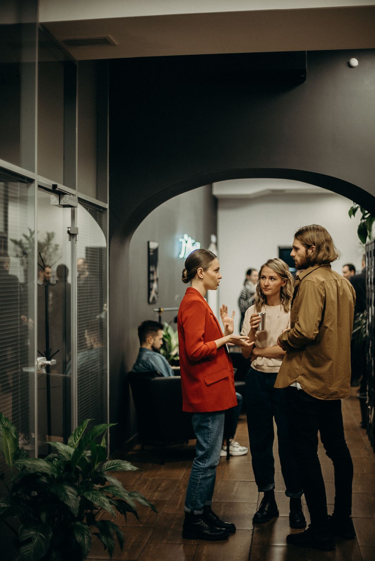 An informal office gathering, people mid-conversation